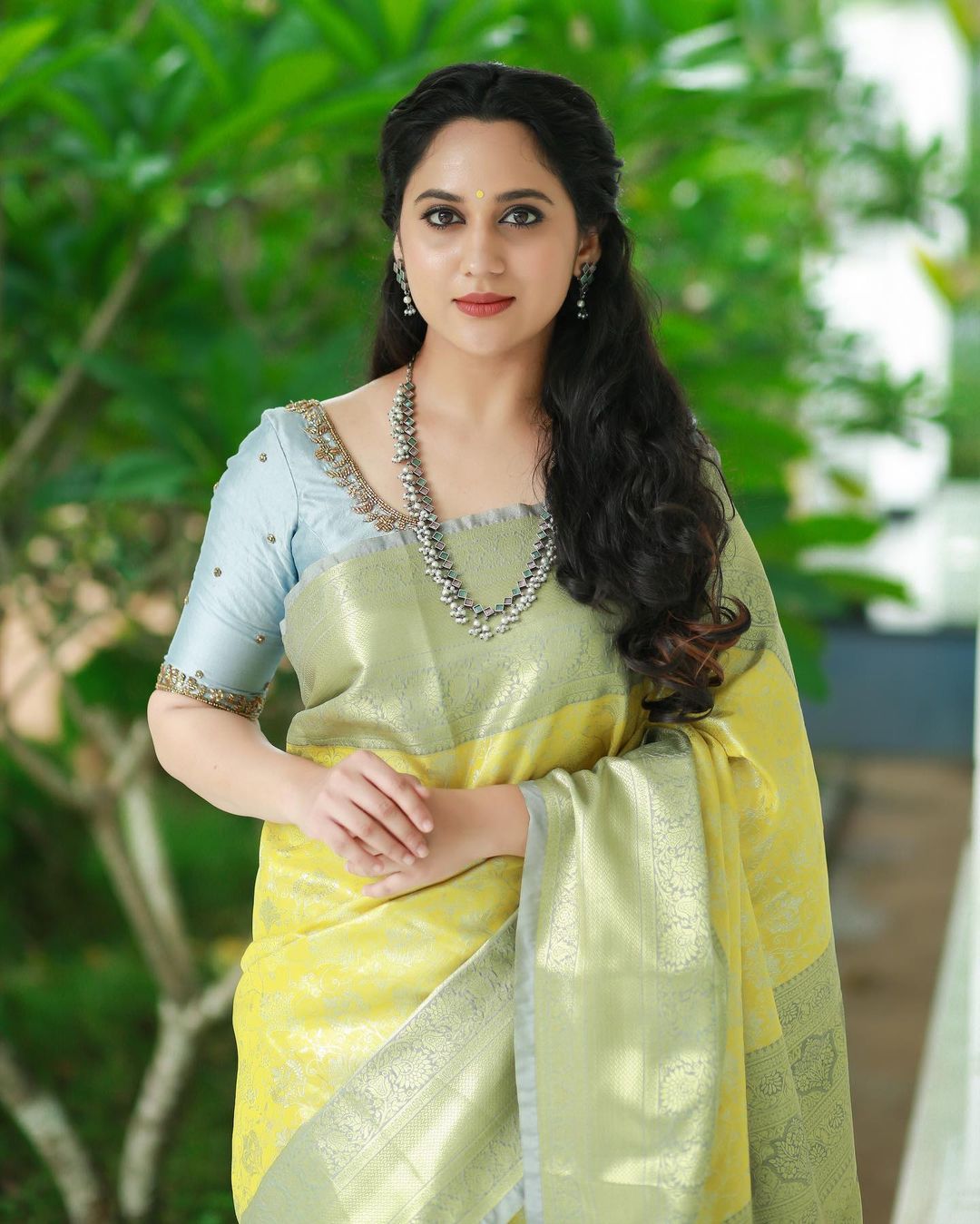 Actress Miya George Beautiful jewelry in Lemon Yellow Saree